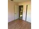 Bedroom featuring laminate floors and a door leading to the en-suite bathroom at 2342 Cilantro Dr, Orlando, FL 32837