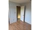 Bedroom featuring laminate floors, light blue walls, and doorway to another room at 2342 Cilantro Dr, Orlando, FL 32837