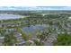 Aerial view of a residential area with a lake and various house styles and landscaping at 2407 Oakington St, Winter Garden, FL 34787