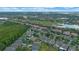 Aerial view of a residential community with houses, trees, and lakes at 2407 Oakington St, Winter Garden, FL 34787