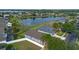 Serene neighborhood with lush greenery, perimeter fencing and a tranquil lake view creates a peaceful residential setting at 2407 Oakington St, Winter Garden, FL 34787