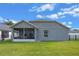 Rear view of home with screened-in lanai, offering a comfortable transition to the outdoor space at 2407 Oakington St, Winter Garden, FL 34787