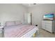 Cozy bedroom featuring neutral colors, a comfortable bed, and ample natural light at 2407 Oakington St, Winter Garden, FL 34787
