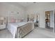 Spacious bedroom featuring a cozy bed and a vanity with clear shelves at 2407 Oakington St, Winter Garden, FL 34787