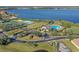 Features community pool, tennis courts, and clubhouse with well-maintained landscaping by a lake at 2407 Oakington St, Winter Garden, FL 34787