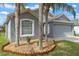 Charming single-story home with a two-car garage and well-maintained lawn at 2407 Oakington St, Winter Garden, FL 34787