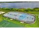 Outdoor hockey rink with basketball hoops is a great recreational space near a lake at 2407 Oakington St, Winter Garden, FL 34787