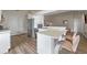 A full kitchen design with a bar top, appliances, and seating at 2407 Oakington St, Winter Garden, FL 34787