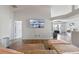 Spacious living room with wood floors, neutral tones, and an open layout, creating a welcoming atmosphere at 2407 Oakington St, Winter Garden, FL 34787