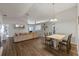 Spacious living room with dining area, hardwood floors and modern decor at 2407 Oakington St, Winter Garden, FL 34787