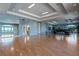 A spacious meeting room with hardwood floors, tray ceilings and a view of the lake at 2407 Oakington St, Winter Garden, FL 34787