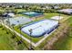 Aerial view showcasing hockey rink, basketball and tennis courts for outdoor activities at 2407 Oakington St, Winter Garden, FL 34787