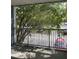 Balcony with view of parking lot and trees at 2516 Grassy Point Dr # 210, Lake Mary, FL 32746