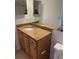 Bathroom vanity featuring a granite countertop, updated fixtures, and a large mirror at 2516 Grassy Point Dr # 210, Lake Mary, FL 32746