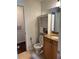 Bathroom featuring a toilet, built-in shelving and a granite vanity at 2516 Grassy Point Dr # 210, Lake Mary, FL 32746