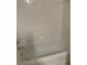Standard bathtub with tiled walls, simple shower fixtures, and bright lighting at 2516 Grassy Point Dr # 210, Lake Mary, FL 32746