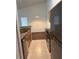 Bright kitchen featuring stainless steel appliances and granite countertops with tile flooring at 2516 Grassy Point Dr # 210, Lake Mary, FL 32746
