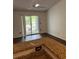 Open-concept living room features a granite countertop and sliding door access to the balcony at 2516 Grassy Point Dr # 210, Lake Mary, FL 32746