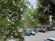Screened-in balcony with lush view of parking lot and pool at 2516 Grassy Point Dr # 210, Lake Mary, FL 32746