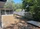 The backyard features mixed fencing, a screened in patio and mature trees at 261 Deleon Rd, Debary, FL 32713