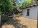 This side yard features an area for storage and a partial view of the exterior at 261 Deleon Rd, Debary, FL 32713