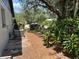 The backyard features mature trees, mixed fencing, and an HVAC unit at 261 Deleon Rd, Debary, FL 32713