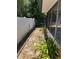 This backyard has lush landscaping, mixed fencing, and a partial view of the home at 261 Deleon Rd, Debary, FL 32713