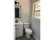 Powder room with modern vanity, matte black hardware, toilet and neutral paint at 261 Deleon Rd, Debary, FL 32713
