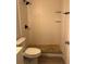 Bathroom featuring a stand up shower with rock floor, modern fixtures, and neutral tile at 261 Deleon Rd, Debary, FL 32713
