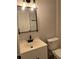 Modern bathroom featuring a white vanity, sleek fixtures, and a well-lit mirror at 261 Deleon Rd, Debary, FL 32713