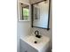Bright bathroom vanity with matte black fixtures and modern mirror at 261 Deleon Rd, Debary, FL 32713