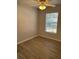 Bright bedroom with a ceiling fan, window with blinds, and wood-look flooring at 261 Deleon Rd, Debary, FL 32713
