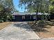 Charming single-story home featuring a spacious driveway and well-maintained landscaping at 261 Deleon Rd, Debary, FL 32713