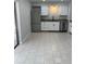 Bright kitchen featuring stainless steel appliances and neutral toned tile flooring at 261 Deleon Rd, Debary, FL 32713