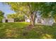 Expansive green backyard with a large mature tree providing shade and a detached storage shed at 2647 S Myrtle Ave, Sanford, FL 32773