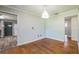 Bright dining room featuring wood floors and neutral-toned walls, ready for personalized touches at 2647 S Myrtle Ave, Sanford, FL 32773