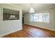 Open living space featuring hardwood floors, gray walls, and views into other rooms at 2647 S Myrtle Ave, Sanford, FL 32773