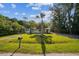Inviting one-story home with well-maintained front lawn and a palm tree in the yard at 2647 S Myrtle Ave, Sanford, FL 32773