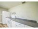 Spacious kitchen featuring white appliances and neutral countertops, providing ample cooking space at 2647 S Myrtle Ave, Sanford, FL 32773