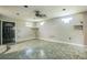Minimalist living room with neutral walls, tile flooring, and natural light at 2647 S Myrtle Ave, Sanford, FL 32773