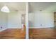 Spacious living room featuring hardwood floors and light gray paneled walls at 2647 S Myrtle Ave, Sanford, FL 32773