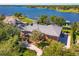 Aerial view showcasing two-story brick home, pristine landscaping and a tile roof at 2828 Marquesas Ct, Windermere, FL 34786