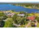 Aerial shot of estate home showcasing lake access and mature landscaping at 2828 Marquesas Ct, Windermere, FL 34786