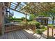Wooden deck with pergola, gazebo, spiral staircase, and a swimming pool at 2828 Marquesas Ct, Windermere, FL 34786