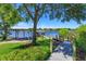 The backyard leads to a dock on the lake with a gazebo at 2828 Marquesas Ct, Windermere, FL 34786