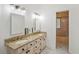 Bathroom featuring double sinks, granite vanity countertops, and tiled floors at 2828 Marquesas Ct, Windermere, FL 34786