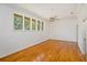 Spacious bedroom featuring hardwood floors, ceiling fan, and large window at 2828 Marquesas Ct, Windermere, FL 34786