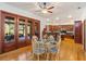 Dining room features hardwood floors, modern lighting, and access to the kitchen at 2828 Marquesas Ct, Windermere, FL 34786