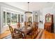 Elegant dining room with a large window, hardwood floors, and a stylish chandelier at 2828 Marquesas Ct, Windermere, FL 34786