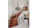 Grand foyer with a winding staircase, ornate chandelier, and marble flooring at 2828 Marquesas Ct, Windermere, FL 34786